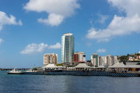 Fort-de-France, Martinique - December 19, 2016: View of the waterfront of Fort de France city with the Simon Hotel, businesses and boats in the harbor of France's Caribbean overseas department of Martinique, Lesser Antilles, French West Indies.のeditorial素材