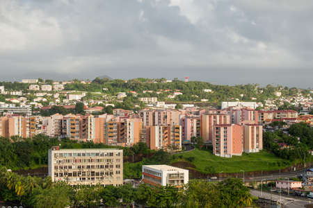 Fort-de-France, Martinique - December 19, 2016: Residential buildings on a slope in the Fort-de-France, Martinique, Lesser Antilles, West Indies, Caribbean. View from the cruise ship in cloudy weather.のeditorial素材