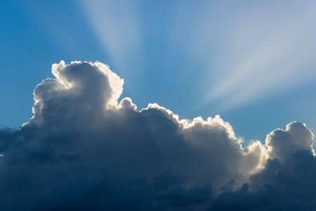 Dramatic cloudscape with sun raysの写真素材