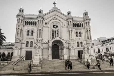 Reggio Calabria, Italy - October 30, 2017: Frontal view of Roman Catholic Cathedral in neo-romanesque style of Reggio Calabria in the Southern Italy. Sepia tone.のeditorial素材