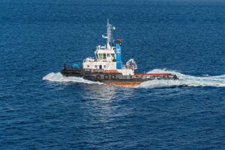 Reggio Calabria, Italy - October 30, 2017: Tug vessel Megrez in the Mediterranean Sea at Reggio Calabria, in Italy. Reggio di Calabria is a city in Calabria on the toe of Italy.のeditorial素材