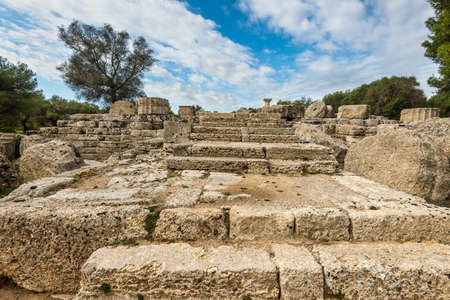 The remains of an architectural columns in archaeological site of Olympia in Peloponnese Greece.の写真素材