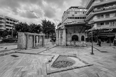 Heraklion, Crete, Greece - November 2, 2019: Ancient Venetian Bembo fountain in Kornarou square, Heraklion, Crete Island, Greece. Drinking water intake. Black and white photography.のeditorial素材