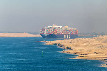 El Qantara, Egypt - November 5, 2017: Large container vessel ship MSC Maya passing Suez Canal in the...