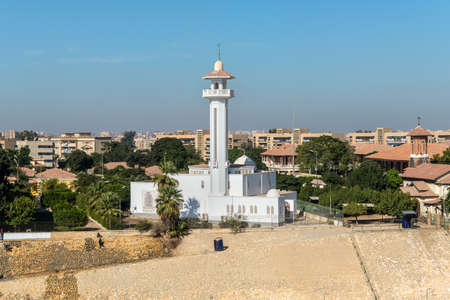 Ismailia, Egypt - November 5, 2017: El Shefaa Mosque on the shore of Suez Canal in Ismailia City, Egypt, Africa. View from the ship on the Suez Canal.のeditorial素材