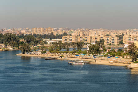 Ismailia, Egypt - November 5, 2017:  Cityscape of Ismailia on the lake Timsah from ship passing Suez...