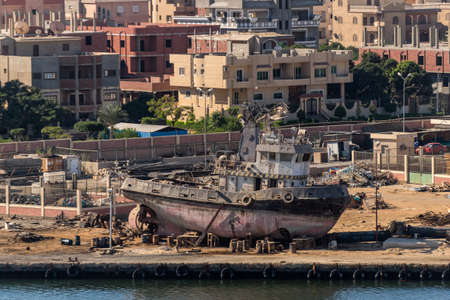 Ismailia, Egypt - November 5, 2017: Tug boat Tarsana 1 under repair at the bank of the Suez Canal, Ismailia, Egypt, Africa.のeditorial素材