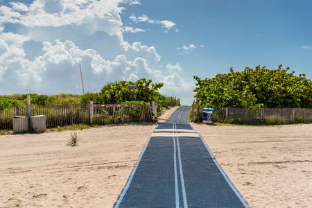Miami, FL, USA - April 19, 2019: Path leading to the beach in South Beach, Miami, Florida, United States. World famous travel location.のeditorial素材