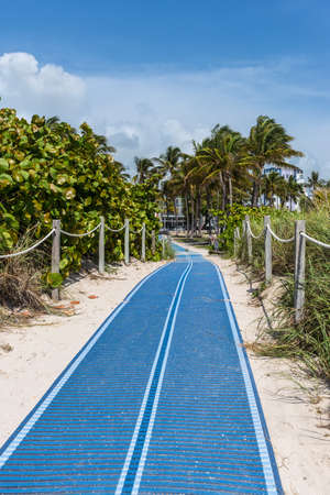 Miami, FL, USA - April 19, 2019: Path leading to the Lummus Park at the historical Art Deco District from South Beach, Miami, Florida, United States of America. World famous travel location.のeditorial素材