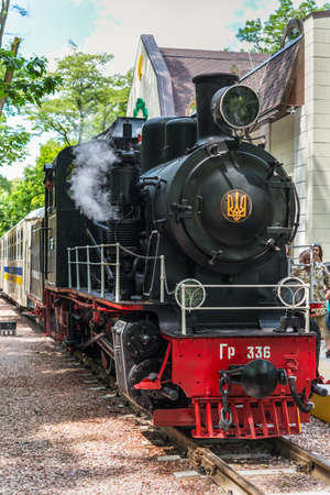 Kyiv, Ukraine - June 1, 2019: Operating old steam locomotive of the Kyiv children's railway in...