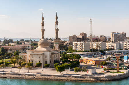 Suez, Egypt - November 5, 2017: An Egyptian Mosque and maritime port at the city of Tawfiq (Suburb of Suez), Eqypt on the southern end of the Suez Canal before exiting into the Red Sea.のeditorial素材