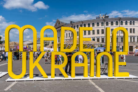 Kyiv, Ukraine - July 13, 2019: Title MADE IN UKRAINE, a street market festival at the weekend, crafts fairs and National University of Kyiv-Mohyla Academy on the background.のeditorial素材