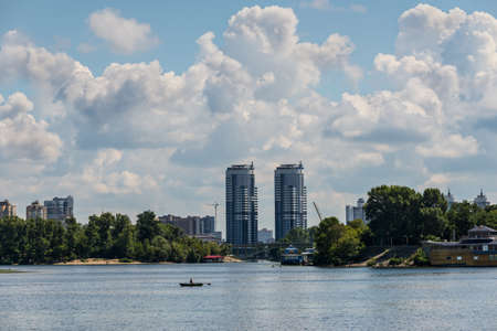 Kyiv, Ukraine - July 13, 2019: Cityscape of Kyiv with the Dnipro River. A large park area in the middle of the city. View of the hydropark and the left bank.のeditorial素材