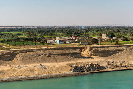 Suez, Egypt - November 5, 2017: Typical Suez canal landscape, farm land along the canal in Egypt, Africa.のeditorial素材