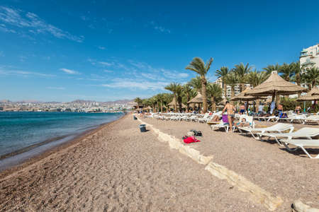 Eilat, Israel- November 7, 2017: People are enjoying a sunny day on a beach in Eilat, Israel. This...