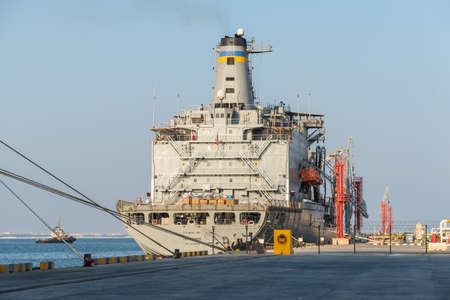 Salalah, Oman - November 12, 2017: US Naval Ship USS Tippecanoe (Supply Replenishment) moored in Port of Salalah in Oman, Indian Ocean.のeditorial素材