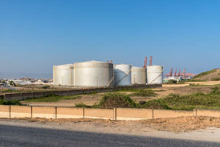 Salalah, Oman - November 12, 2017: Fuel Storage Tanks of the Salalah Fuel Terminal in Oman, Indian Ocean.のeditorial素材