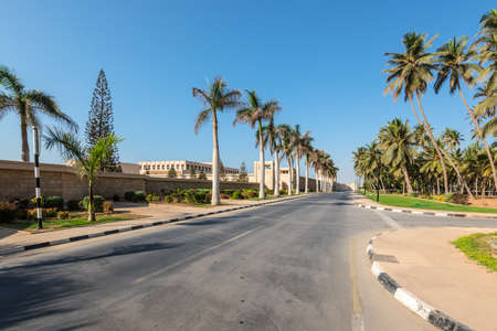 Salalah, Sultanat of Oman - November 12, 2017: Street view of the As Sultan Qaboos Str. in Salalah, Dhofar Province, Oman. The Al Hosn Sultanâs Palace in the left.のeditorial素材