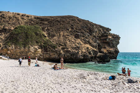 Salalah, Oman - November 12, 2017: People from a cruise ship relax on the Oasis Beach in Oman, Indian Ocean. The beach is very close to the Salalah cruise port shuttle stop.のeditorial素材
