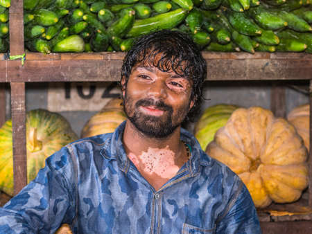 Male, Maldives - November 16, 2017: Vegetable and fruit seller in the Vegetable & Dry Fish Market in the city and island of Male, capital of Maldives.のeditorial素材