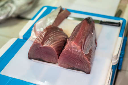 Fresh Fillet of Big Tuna on a counter at a fish market in Male, Maldivesの写真素材