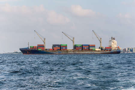 Male, Maldives - November 17, 2017: Container Ship PACIFIC VOYAGER in the outer harbor of Male...