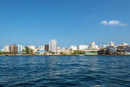 Male, Maldives - November 18, 2017: Waterfront cityscape of Male city as seen from the boat in Maldives, Indian Ocean.のeditorial素材