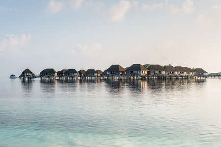 Water bungalows and sea in a tropical paradise island in Maldivesの写真素材