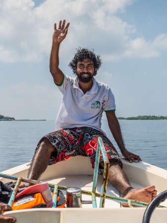 Huraa, Maldives - November 19, 2017: Guide on a boat en route to the Turtle and Shark Safari tour near the island of Huraa in the Maldives, North Male Atoll, Indian Ocean.のeditorial素材