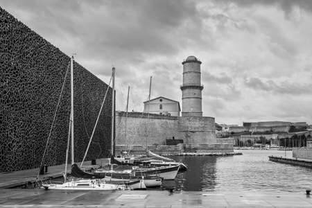 Marseille, France - November 30, 2018: Fort Saint-Jean and yachts near the Museum of Civilizations in Marseille, Provence, France. Black and white photography.のeditorial素材