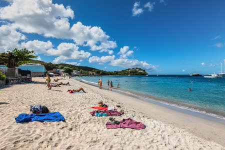 Les Trois-Ilets, Martinique - December 13, 2018: People relax on the tropical Anse Mitan Beach at Les Trois-Ilets, peninsula Pointe du Bout, Martinique, FWI.のeditorial素材