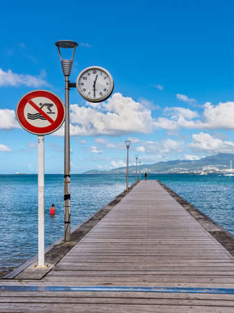 Les Trois-Ilets, Martinique - December 13, 2018: Clock on the Anse-a-l'Ane pier in the city of Les Trois-Ilets, Martinique.のeditorial素材