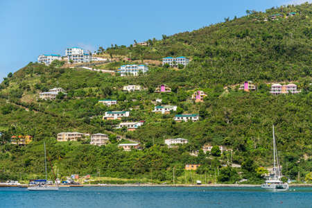 Cane Garden Bay, Tortola, British Virgin Islands - December 16, 2018:  Colorful hillside houses in famous Cane Garden Bay, a popular tourist destination in the Caribbean island of Tortola, British Virgin Islands.のeditorial素材