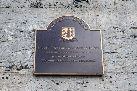 Cane Garden Bay, Tortola, British Virgin Islands - December 16, 2018: Information plate of the Tortola's Legendary Callwood Rum Distillery - a history of rummaking dates back some 400 years.のeditorial素材