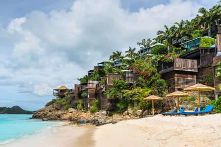 Valley Church Bay, Antigua and Barbuda - December 18, 2018: Cocos Hotel with wooden cottages on a hill with view of the Caribbean in Antigua and Barbuda near Valley Church Beach.のeditorial素材