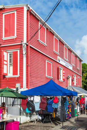 St John's, Antigua and Barbuda - December 18, 2018: Street view of St John's with Cultural Development Division building and street vendors in St. John's, Antigua, West Indies, Caribbean.のeditorial素材