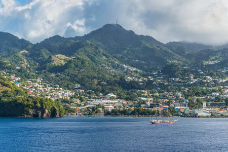 Kingstown, Saint Vincent and the Grenadines - December 19, 2018: Coastline view of the port and city of Kingstown, capital of Caribbean island Saint Vincent. Sailing Vessel Buona Onda in the foreground.のeditorial素材