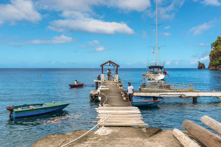 Wallilabou Bay, Saint Vincent and the Grenadines - December 19, 2018: A view from a jetty out to sea at Wallilabou Anchorage - Pirates of the Caribbean's Port Royale - Saint Vincent.のeditorial素材