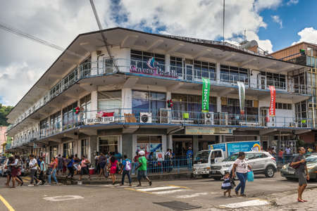 Kingstown, St Vincent and the Grenadines - December 19, 2018: Street view of Kingstown at day with shops and walkers in the middle of the capital city, Saint Vincent island, Saint Vincent and the Grenadines.のeditorial素材