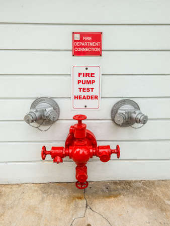 Miami, FL, United States - April 19, 2019: Firepump test headers on the wall in Miami, Florida, United States of America.のeditorial素材