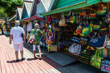 Ocho Rios, Jamaica - April 22, 2019: Tourists walk at souvenir street market in the tropical Caribbean island of Ocho Rios, Jamaica. Today the city is one of Jamaica's most top tourist destinations.のeditorial素材