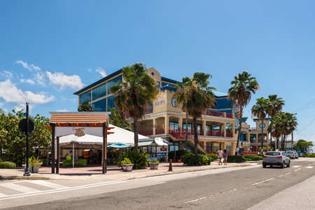 George Town, Grand Cayman Island, UK - April 23, 2019: Street view of George Town at day with palms near shopping mall in downtown of George Town, Grand Cayman, Cayman Islands, BWI.のeditorial素材