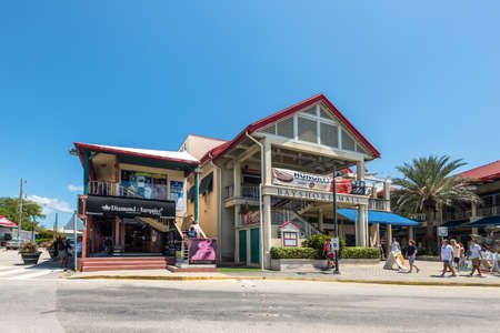 George Town, Grand Cayman Island, UK - April 23, 2019: Street view of George Town at day with tourists near shopping mall in downtown of George Town, Grand Cayman, Cayman Islands, BWI.のeditorial素材