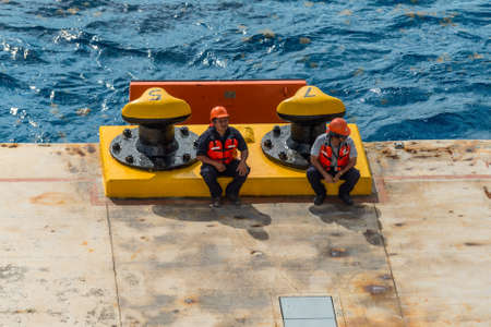 Cozumel, Mexico - April 24, 2019: Mooring gang and port workers awaiting mooring operation in Port of Cozumel, Mexico, Caribbean.のeditorial素材