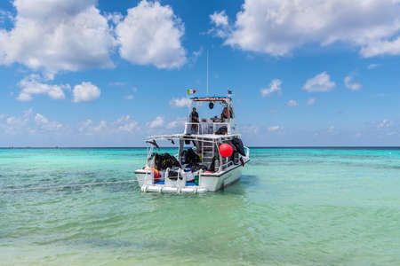 Cozumel, Mexico - April 24, 2019: Boat with diving equipment waiting for tourists on the Palancar beach in Playa Palancar, Quintana Roo, Mexico.のeditorial素材