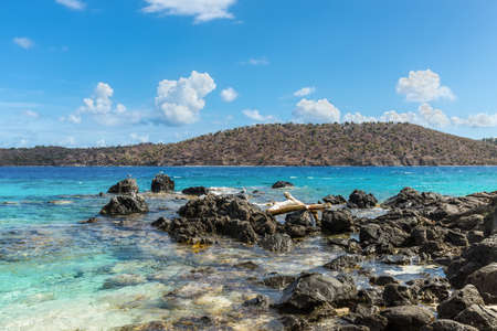 Seascape with a rocky coast of the Coki Point Bech in the foreground and the Thatch Cay island in the background - St Thomas, US Virgin Islands , Caribbeanの写真素材