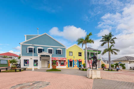 Point Blanche, St. Maarten - May 1, 2019: Shopping district in Cruise port of St. Maarten (Netherlands). Monument to a pirate in the foreground. Scenic Caribbean vacation.のeditorial素材