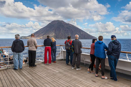 Stromboli, Italy - November 10, 2019: Passengers on board of the cruise ship viewing beautiful seascape with Stromboli island in the Tyrrhenian Sea, of the north coast of Sicily, Italy.のeditorial素材