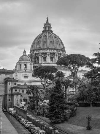 Vatican City State - November 8, 2019: The Saint Peter's Basilica in Vatican City on a rainy day. Black and white retro style - monochrome color tone.のeditorial素材