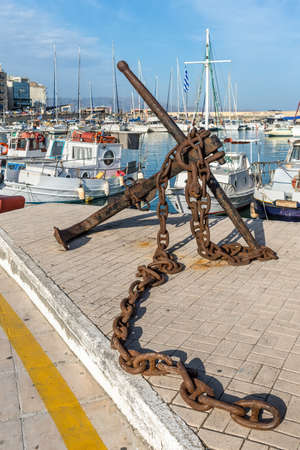 Heraklion, Greece - November 12, 2019: Old big rusty anchor and chain near the old Venetian shipyards in Heraklion's coastal road, Crete island, Greece.のeditorial素材